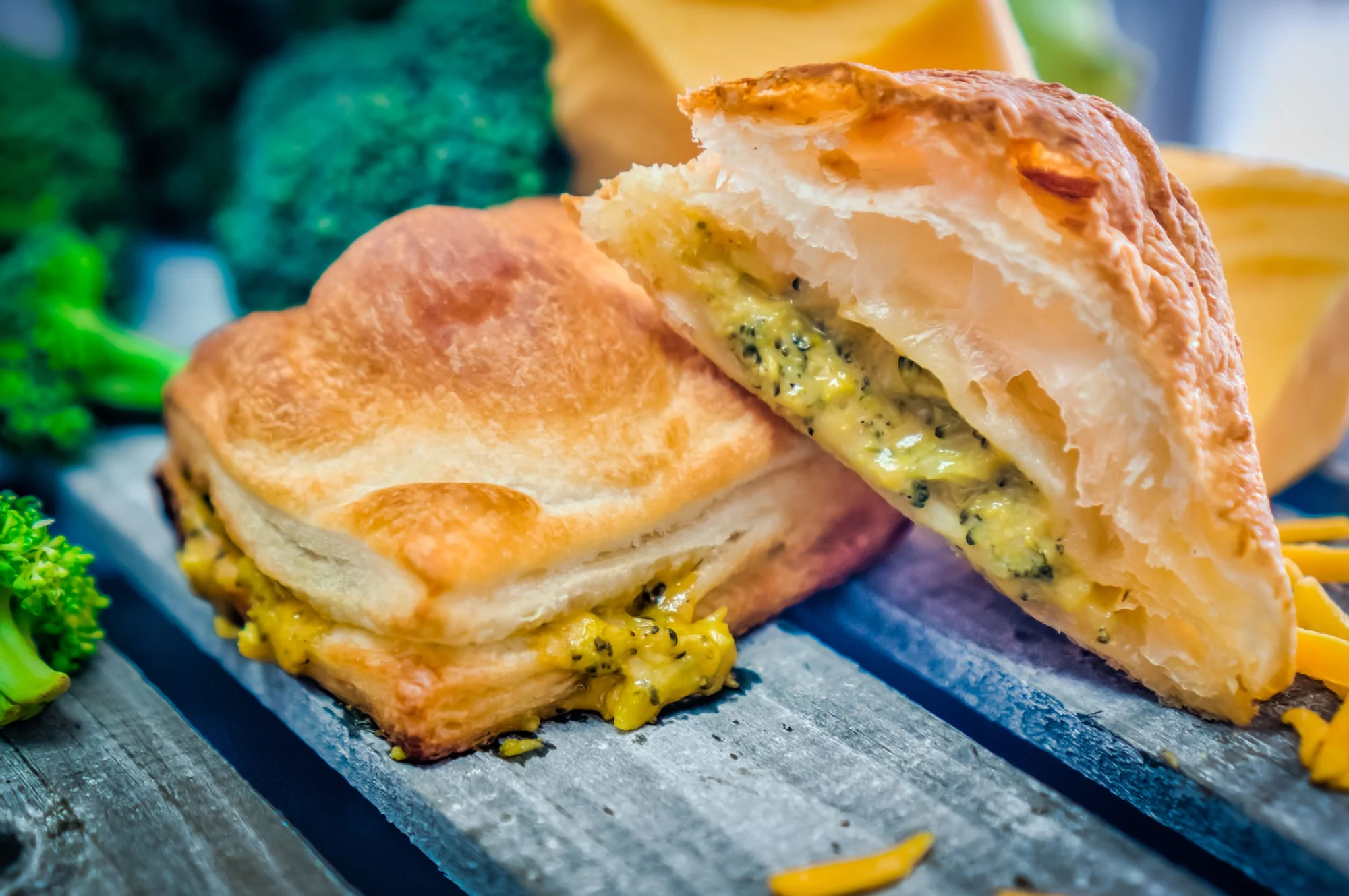 A flaky savory mini puff pastry pie cut open to show its filling