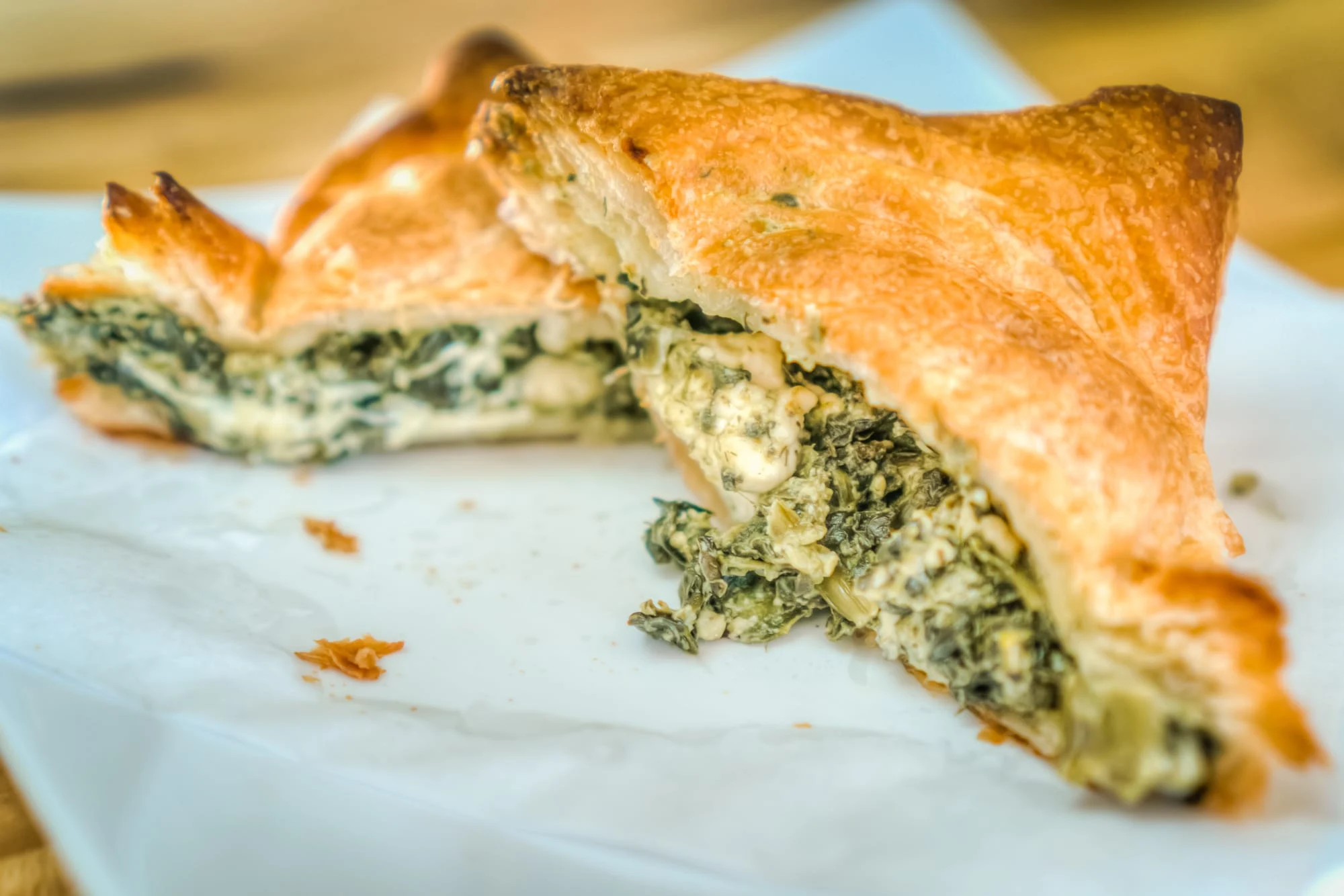 A toasted Buttered Up croissant sandwich filled with savory ingredients