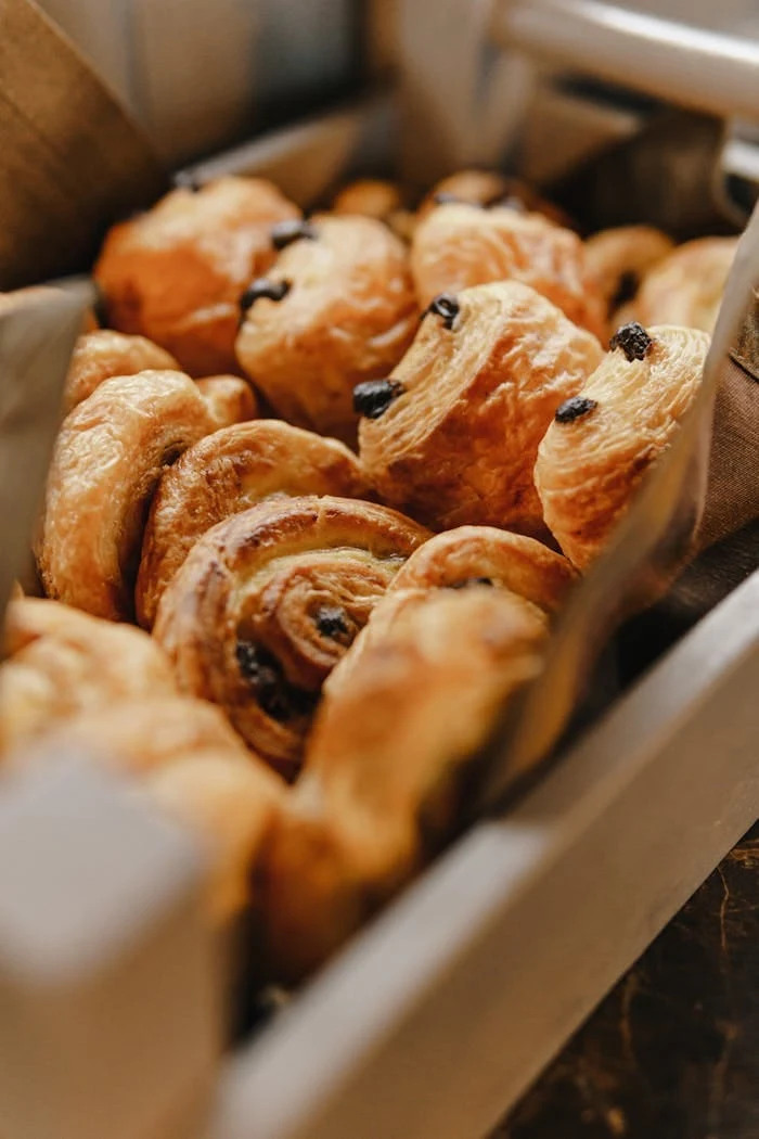 Freshly baked butter croissants with deeply golden laminated layers
