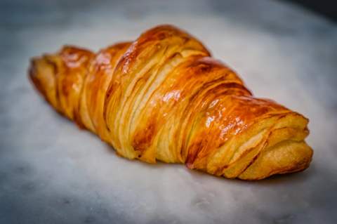 A tray of golden croissants ready for the morning