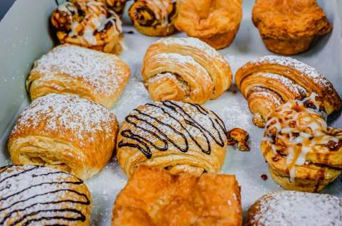 Fresh pastries arranged on a bakery tray