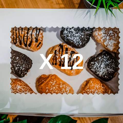 A dozen assorted Buttered Up pastries ready to share